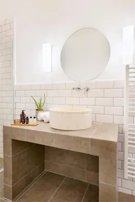 a bathroom with a sink and a large mirror at Maryflower Premium Apartments Piraeus in Piraeus