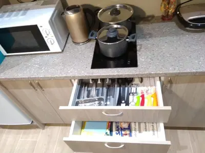 a kitchen counter with a counter top with a microwave at Comfortable apartment in the center of Athens in Athens