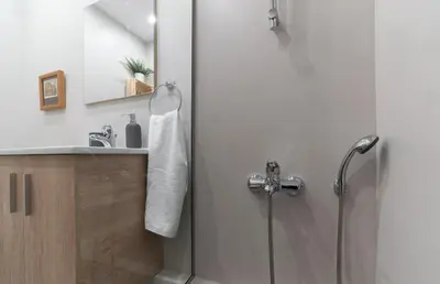 a bathroom with a shower and a sink at Αbsolute Athens VIII in Athens