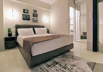 a bedroom with a large bed in a room at Athens Iris Hotel in Athens