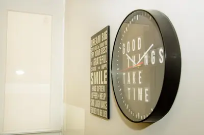 a mirror hanging on a wall next to a window at Neighborly Nest - Apartment in the heart of Athens in Athens