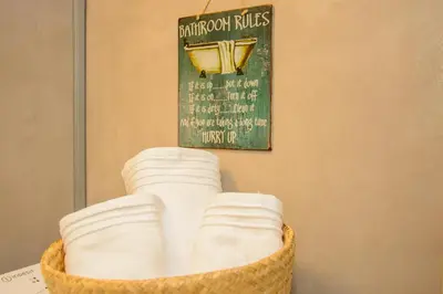 a basket on a table with a sign on the wall at Neighborly Nest - Apartment in the heart of Athens in Athens
