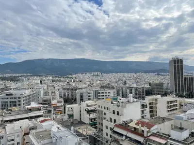 a view of a city with buildings and mountains at Athens 360 penthouse, panoramic City view in Athens