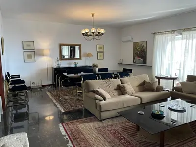 a living room with a couch and a table at Athens 360 penthouse, panoramic City view in Athens