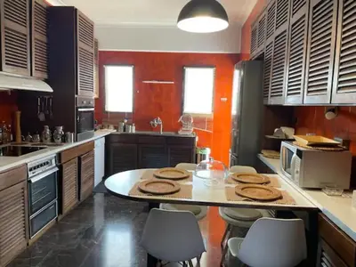 a kitchen with a table with cookies on it at Athens 360 penthouse, panoramic City view in Athens