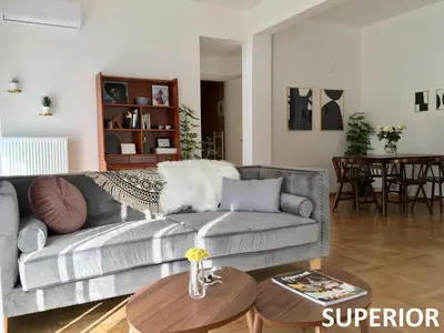 a living room with a couch and a table at Sunkissed Rooftop Apartments in Athens