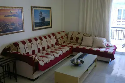 a living room with a couch and a table at Elegant Athenian Apartment in Athens