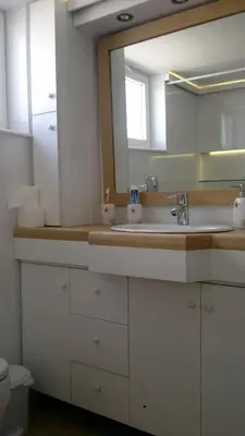 a bathroom with a sink and a mirror at Elegant Athenian Apartment in Athens