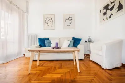 a living room with a table and a couch at Acropolis Exceptional View in Athens