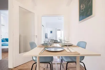 a dining room table with chairs and a plate on it at Acropolis Exceptional View in Athens