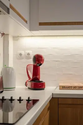 a red appliance sitting on top of a kitchen counter at Athenian LInes, 50 meters from Acropolis Museum in Athens