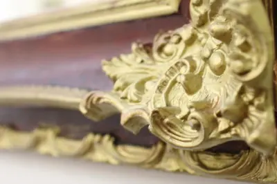 a close up of a gold mirror on a table at Athens Delta Hotel in Athens