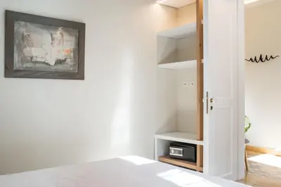 a bedroom with a bed and a book shelf at Nest in Athens