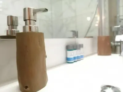 a soap dispenser sitting on top of a bathroom sink at Athens city center cozy apartment in Athens