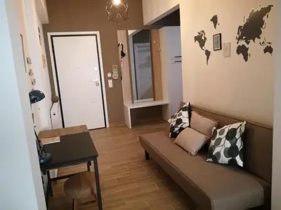a living room with a couch and a table at Athens city center cozy apartment in Athens