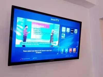 a flat screen tv hanging on a wall at Athens city center cozy apartment in Athens