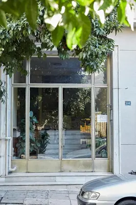 a store front with a large glass window at Charming 1bd Apt at Concert Hall in Athens