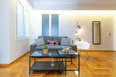 a living room with a couch and a table at TONI'S 
