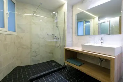 a bathroom with a sink and a shower at TONI'S 