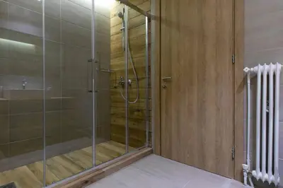 a shower with a glass door in a bathroom at TONI'S 