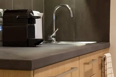 a kitchen counter top with a sink and a sink at TONI'S Fashionable Studio near Presidential Garden in Athens