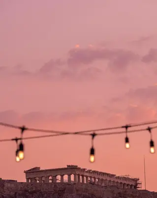 a row of traffic lights in front of a building at Ergon House Athens in Athens