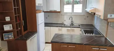 a kitchen with a sink and a counter top at Secret Aktis by BluPine in Athens