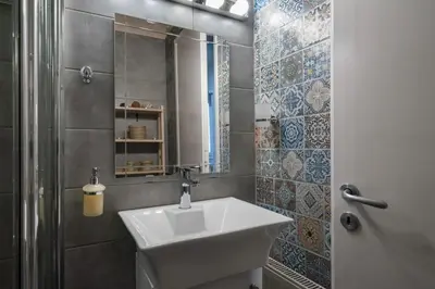 a bathroom with a sink and a shower at Autonomous house in the heart of Plaka in Athens
