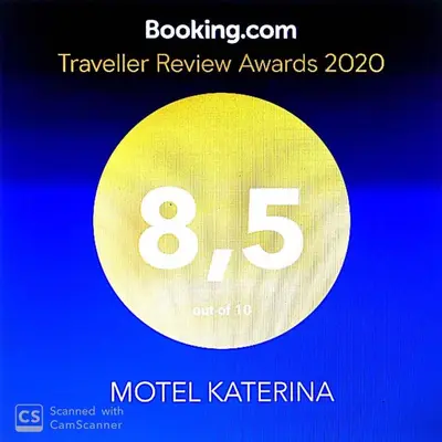 a sign that reads motel katerina with a yellow circle at MOTEL KATERINA in Keratea