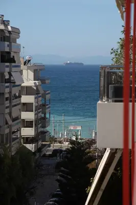 a view of the ocean from a building at Edem Beach Apartment with Sea View by Athenian Homes in Athens
