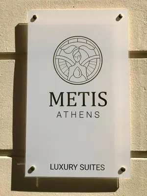 a sign formtris athens on a wall at Metis Athens Suites in Athens