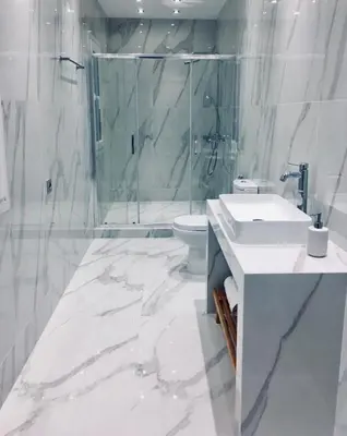 a white bathroom with a sink and a shower at Metis Athens Suites in Athens