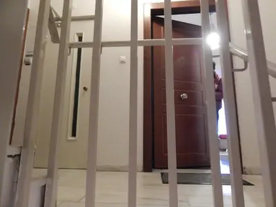a staircase leading to a room with a mirror at ATHENS RIVIERA SEA VIEW APARTMENT in Piraeus