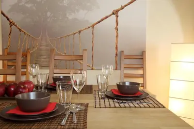 a dining room table with glasses and plates of food at Dream Penthouse in Athens - Kolonaki in Athens