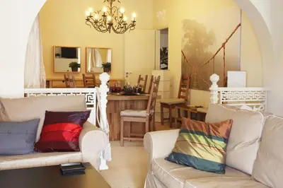 a living room with two couches and a dining room at Dream Penthouse in Athens - Kolonaki in Athens