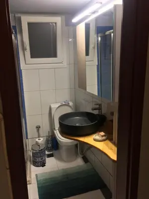 a bathroom with a sink and a toilet at Joges 2 in Athens