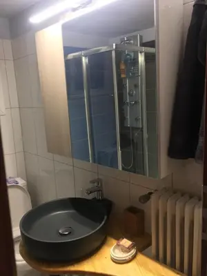 a bathroom with a black sink and a mirror at Joges 2 in Athens