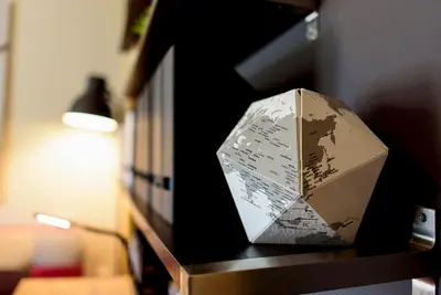 a paper box sitting on a shelf next to a lamp at warm cozy & quiet in Athens