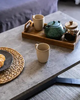 a table with two cups and a tray with tea pots at PAME House in Athens
