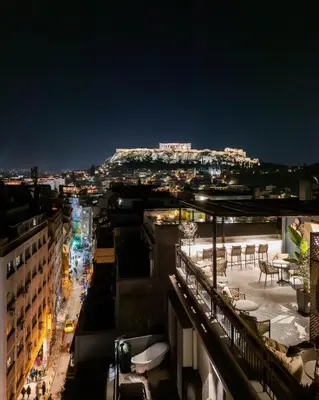 a view of a city at night at PAME House in Athens