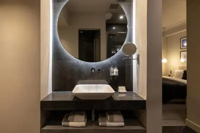 a bathroom with a sink and a mirror at Oniro City in Athens