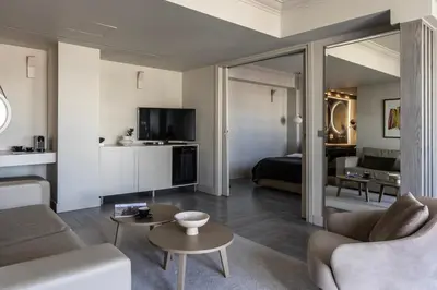 a living room with a couch and a bed at Oniro City in Athens