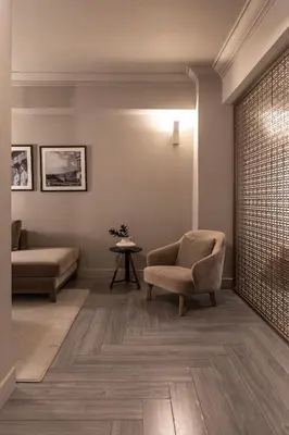 a living room with a chair and a couch at Oniro City in Athens