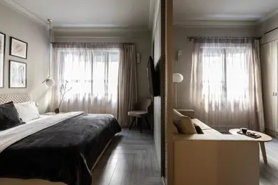 a bedroom with a large bed and a window at Oniro City in Athens