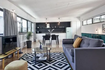 a living room with a couch and a table at MONO Lofts in Athens