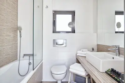 a bathroom with a sink and a toilet and a shower at MONO Lofts in Athens