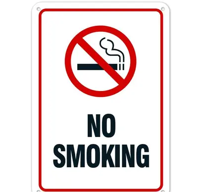 a sign with a no smoking sign on it at Elaėa Boutique Apartments in Piraeus