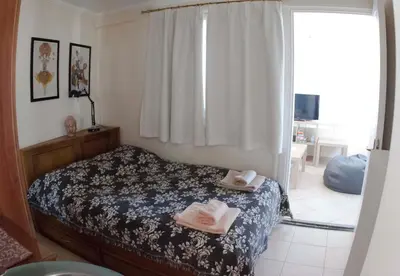 a bedroom with a bed with two towels on it at Acropolis View in Athens