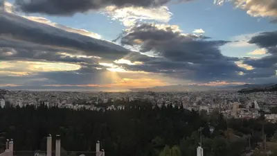 a view of a city under a cloudy sky at Acropolis View in Athens