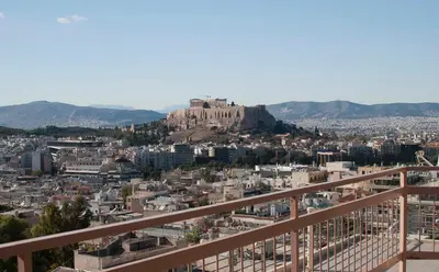 a view ofhenshenshenshens city from the balcony of a building at Acropolis View in Athens